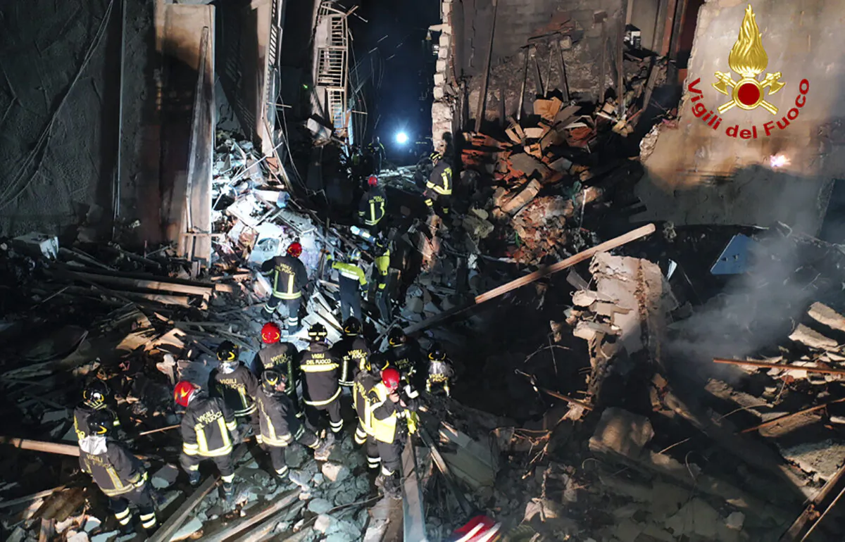 Italian firefighters and rescuers search for survivors among the rubble of a collapsed building, in Ravanusa, Sicily, Italy, on Dec. 12, 2021. (Italian Firefighters Vigili del Fuoco via AP)