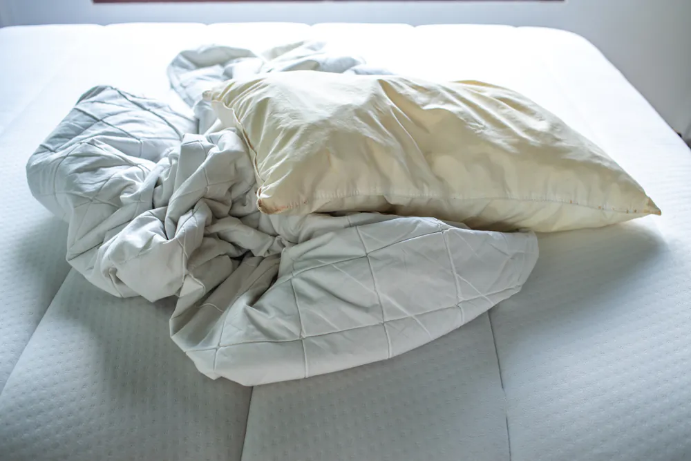 Wadded up sheets in the washer or dryer are a common laundry headache. (eyepark/Shutterstock)