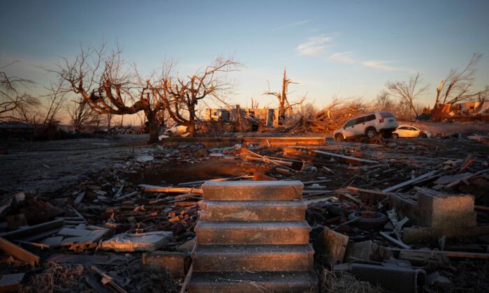 The front steps of a house are all that remains after a tornado in Dawson Springs, Ky., on Dec. 12, 2021. (Michael Clubb/AP Photo)