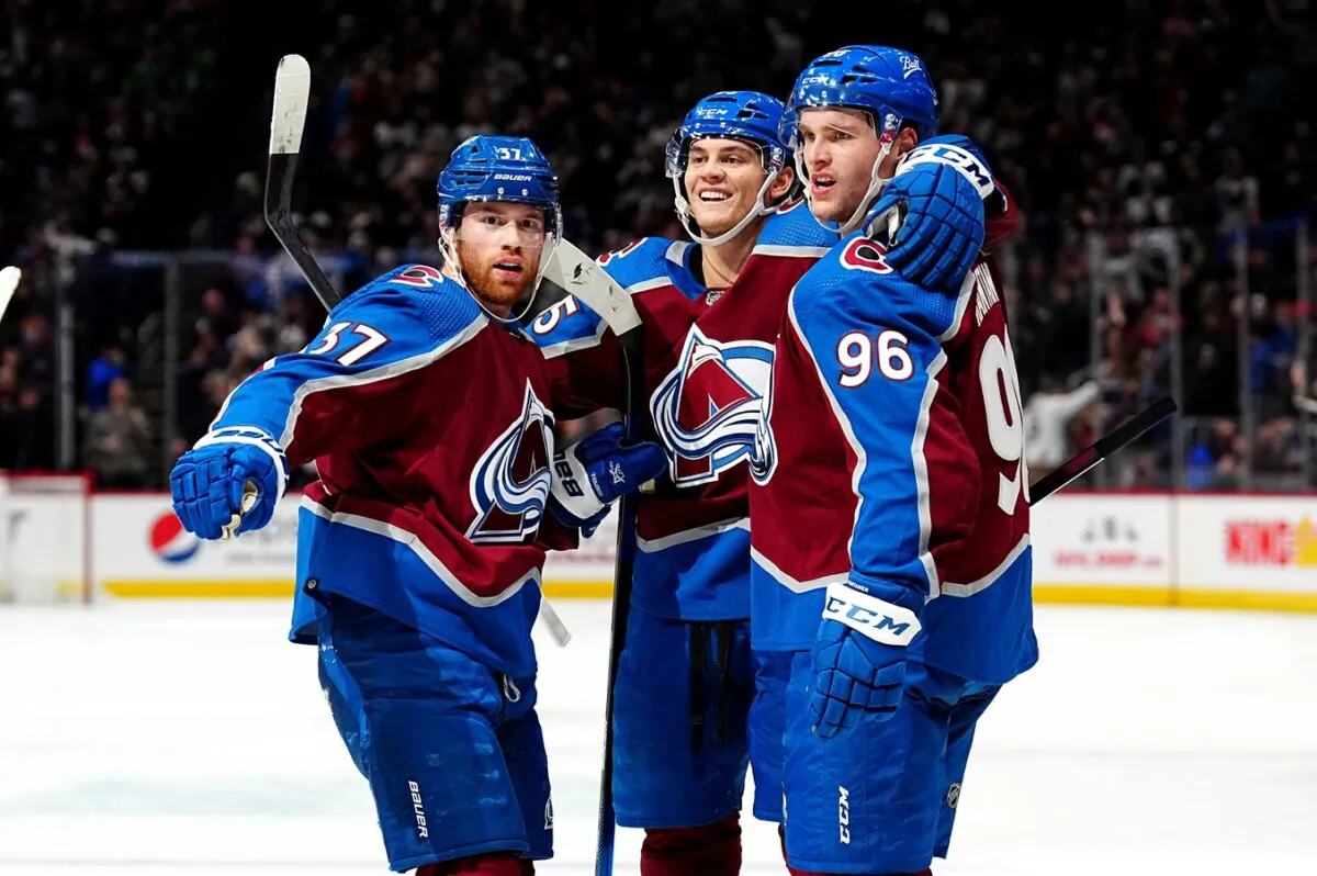 Colorado Avalanche left wing Andre Burakovsky (95) celebrates his goal with teammates left wing J.T. Compher (37) and right wing Mikko Rantanen (96) in the second period against the Florida Panthers at Ball Arena in Denver, on Dec 12, 2021. (Ron Chenoy/USA TODAY Sports via Field Level Media)