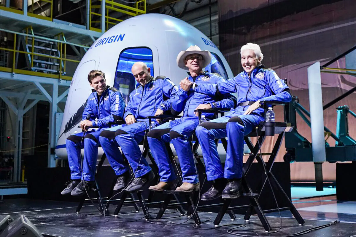 (L-R) Oliver Daemen, Mark Bezos, Jeff Bezos, founder of Amazon and space tourism company Blue Origin, and Wally Funk participates in a post launch briefing where they discussed their flight experience aboard the Blue Origin New Shepard rocket at its spaceport near Van Horn, Texas, on July 20, 2021. (Tony Gutierrez/AP Photo)