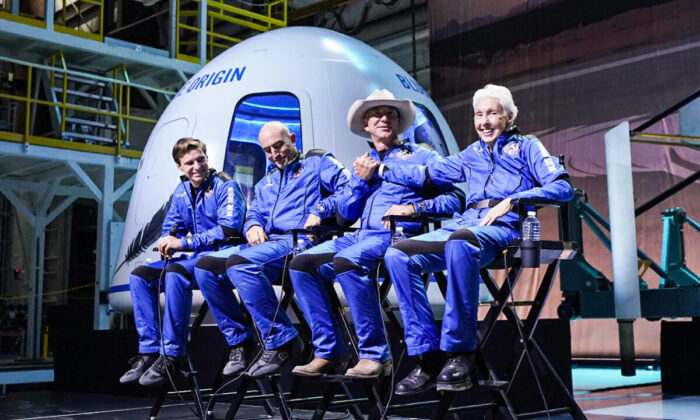 (L-R) Oliver Daemen, Mark Bezos, Jeff Bezos, founder of Amazon and space tourism company Blue Origin, and Wally Funk participates in a post launch briefing where they discussed their flight experience aboard the Blue Origin New Shepard rocket at its spaceport near Van Horn, Texas, on July 20, 2021. (Tony Gutierrez/AP Photo)