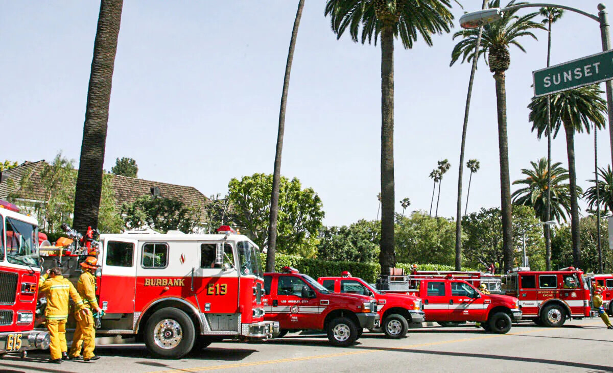 Firefighters gather at Sunset Boulevard in Beverly Hills on April 12, 2007. (Gabriel Bouys/AFP via Getty Images)