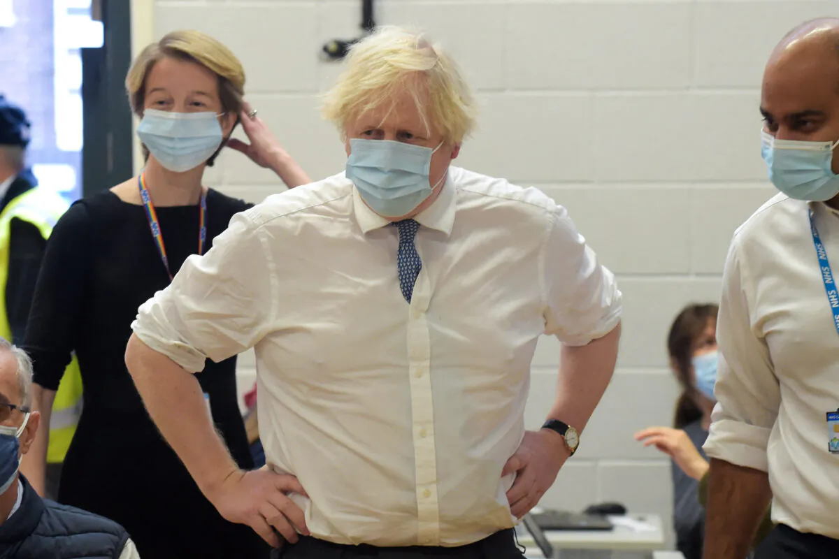 UK Prime Minister Boris Johnson visits the Health at the Stowe vaccination center in central London, on Dec. 13, 2021. (Jeremy Selwyn/AFP via Getty Images)