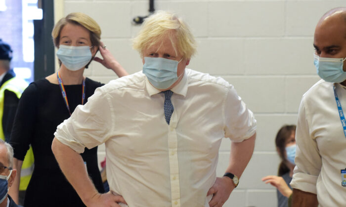 UK Prime Minister Boris Johnson visits the Health at the Stowe vaccination center in central London, on Dec. 13, 2021. (Jeremy Selwyn/AFP via Getty Images)