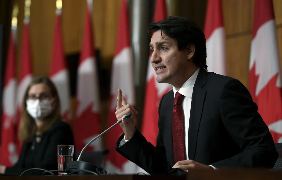 Prime Minister Justin Trudeau answers a question during an announcement on early learning and child care in New Brunswick, in Ottawa, on Dec. 13, 2021. (The Canadian Press/Justin Tang)