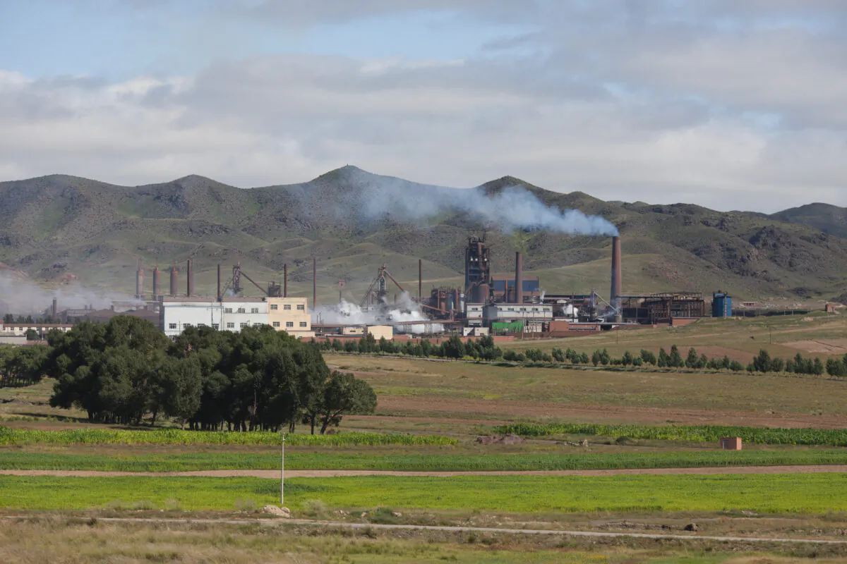 A photo taken on August 20, 2012 shows a general view of a rare earth refinery north of the inner Mongolian city of Baotou. On the edge of the Chinese city of Baotou, a 10-square-kilometre lake is blackened by pollution from factories processing rare earths, elements essential for the production of mobile phones and computers.  (Ed Jones/AFP via Getty Images)
