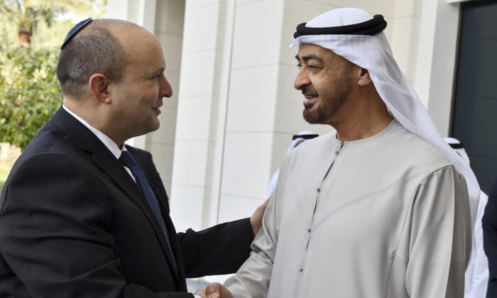 Israeli Prime Minister Naftali Bennett, left, received by Abu Dhabi Crown Prince Sheikh Mohammed bin Zayed at his private palace in Abu Dhabi, on Dec. 13, 2021. (Haim Zach/Israel Government Press Office via AP)