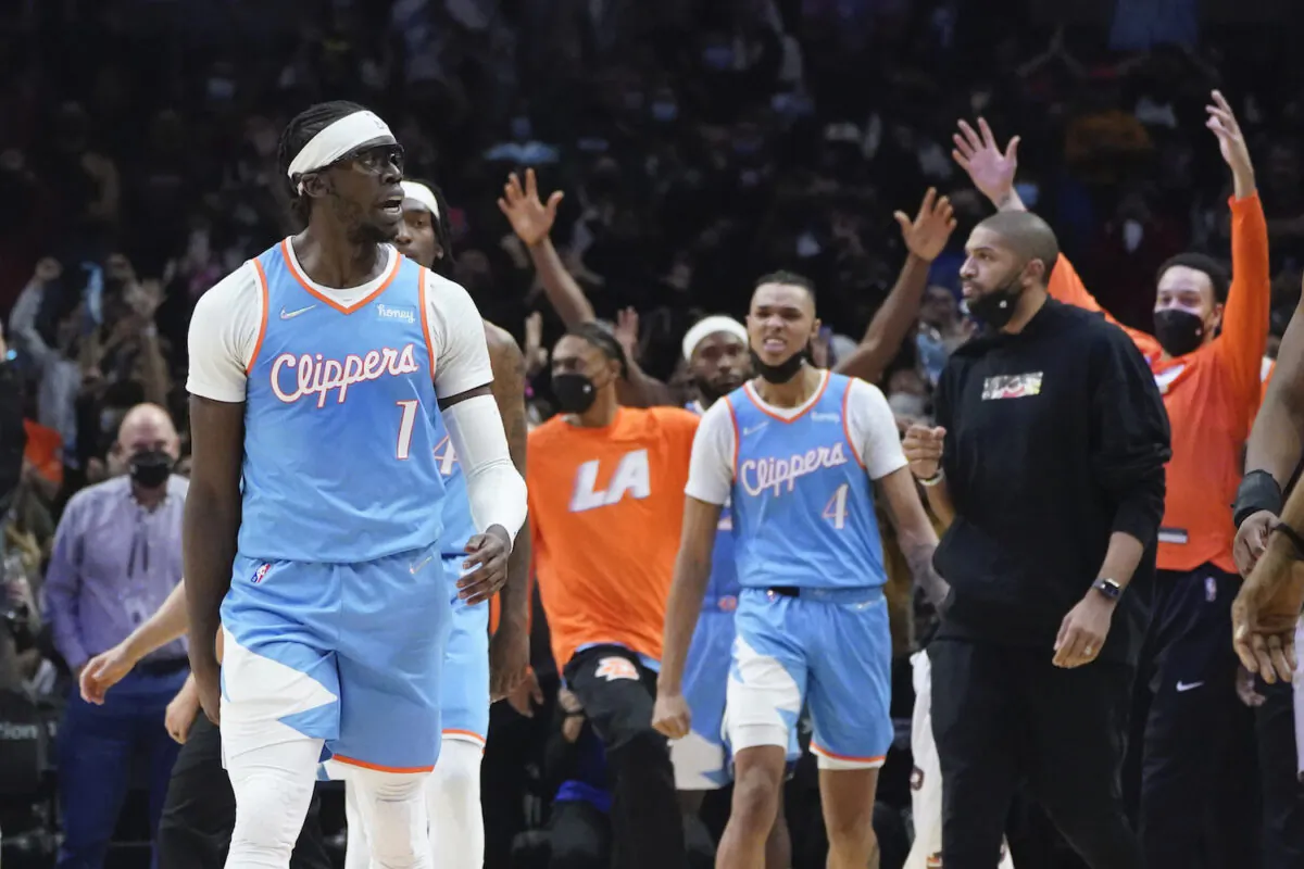 Los Angeles Clippers guard Reggie Jackson (1) celebrates after scoring late in the fourth quarter of an NBA basketball game against the Orlando Magic in Los Angeles Dec. 11, 2021. (AP Photo/Marcio Jose Sanchez)