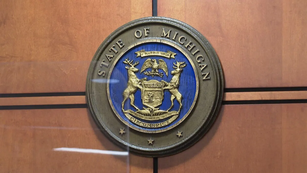 The Michigan seal affixed to the wall above Carniak's seat at the Oakland County District Court in Rochester Hills, Mich., on Dec. 13, 2021, in a still from video. (AP/Screenshot via The Epoch Times)