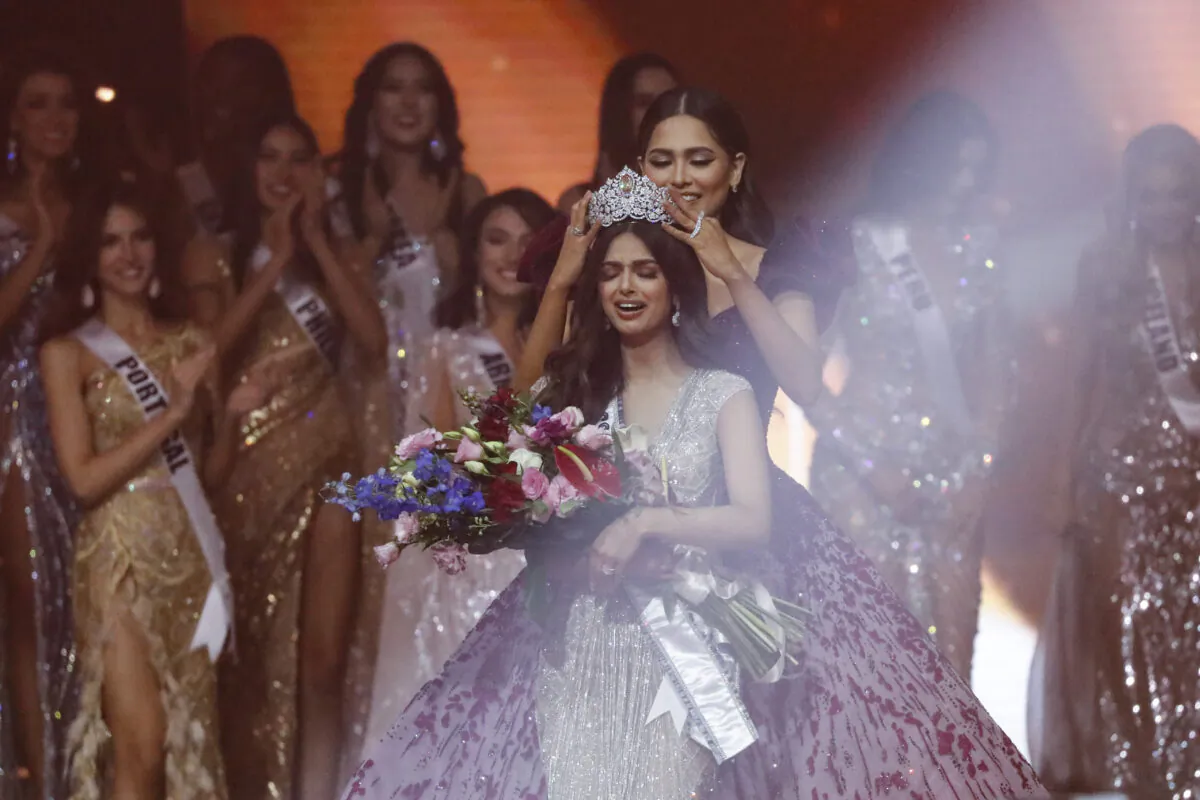 Miss Universe 2020 Andrea Meza (R) crowns India's Harnaaz Sandhu as Miss Universe 2021 during the 70th Miss Universe pageant in Eilat, Israel, on Dec. 13, 2021. (Ariel Schalit/AP Photo)
