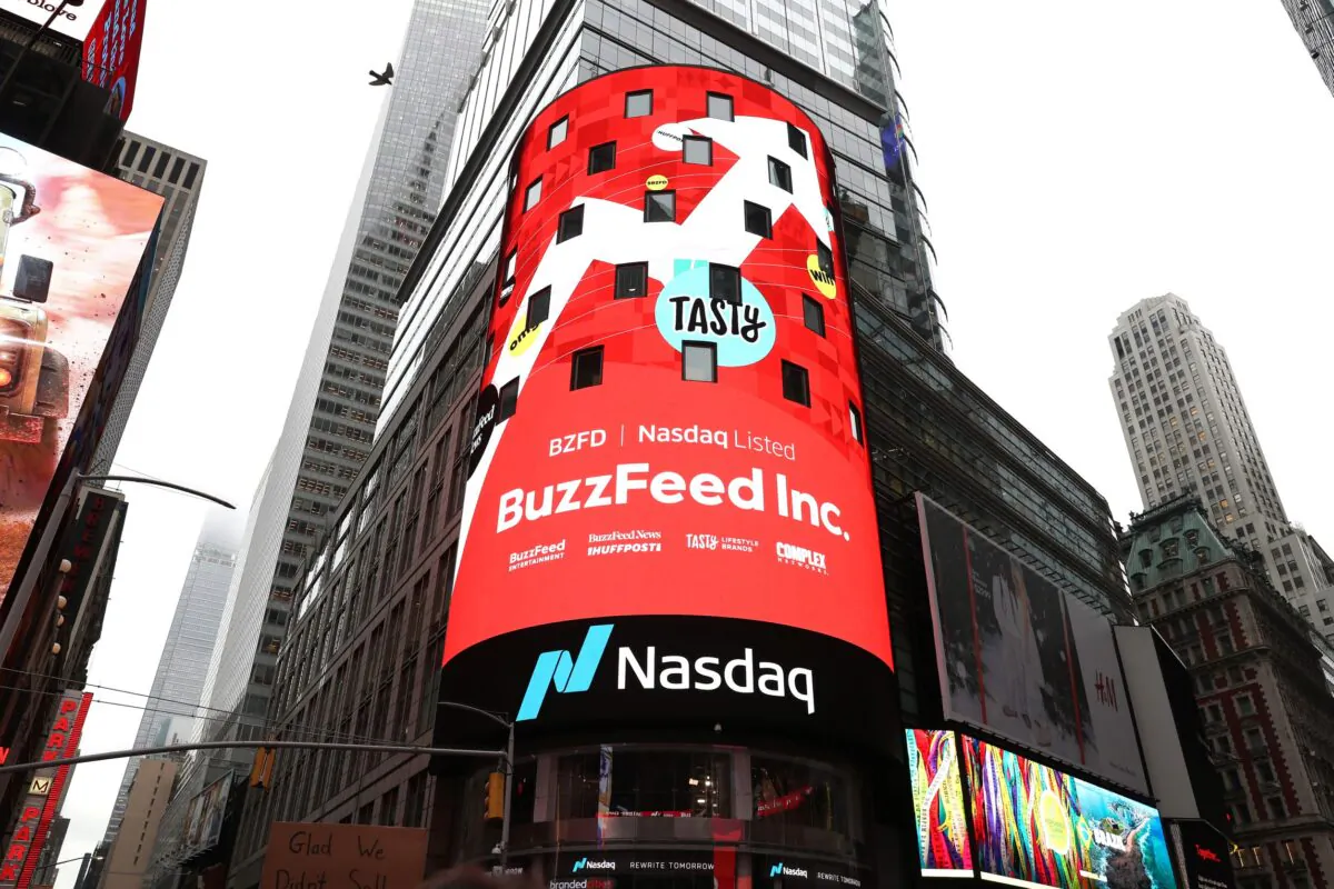BuzzFeed screens at Times Square during BuzzFeed Inc.'s Listing Day at Nasdaq in New York City on Dec. 6, 2021. (Bennett Raglin/Getty Images for BuzzFeed Inc.)