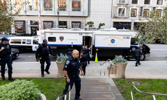 Police patrol Union Square in San Francisco on on Nov. 30, 2021. Stores have increased security in response to a spike in thefts. (Ethan Swope/Getty Images)