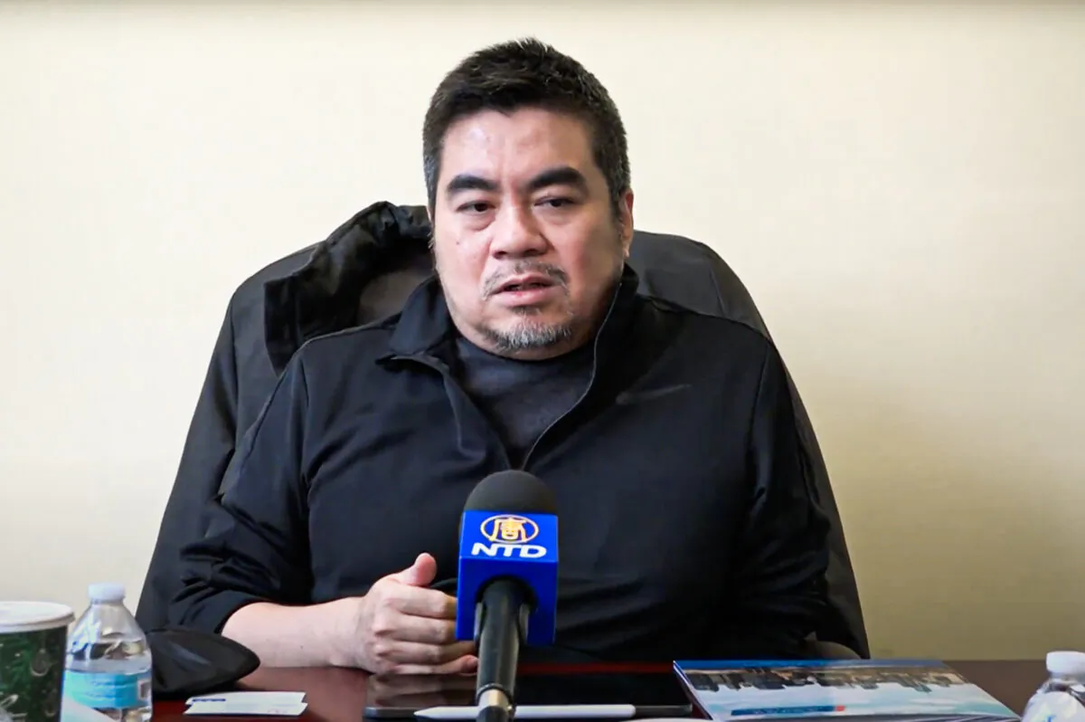 Cheng San, an American game designer, speaks at a press conference in Flushing, New York, on Dec. 9, 2021. (NTD)
