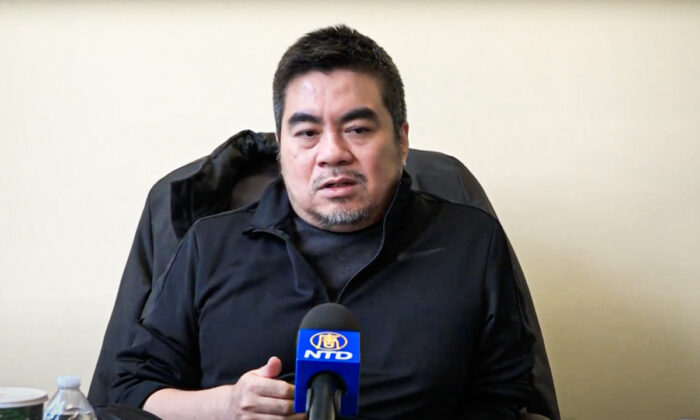 Cheng San, an American game designer, speaks at a press conference in Flushing, New York, on Dec. 9, 2021. (NTD)