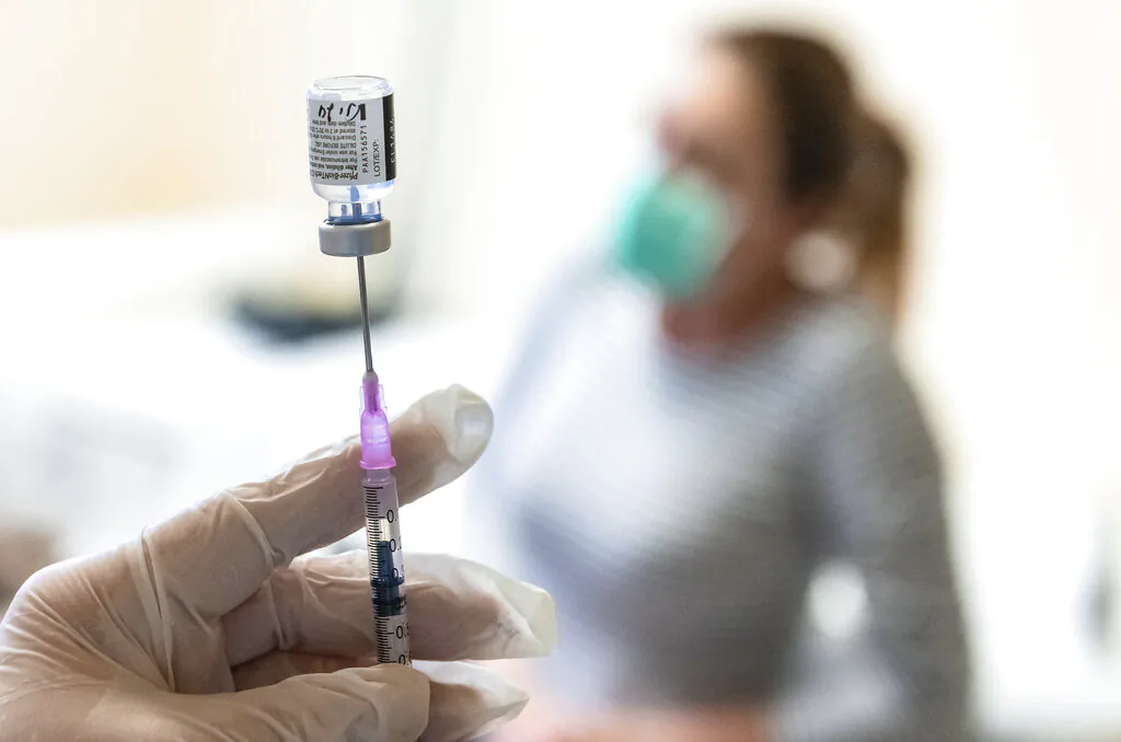 A nurse prepares a dose of a COVID-19 vaccine to be injected at the Andras Josa Teaching Hospital in Nyiregyhaza, Hungary, on Jan. 24, 2021. (Attila Balazs/MTI via AP, File)