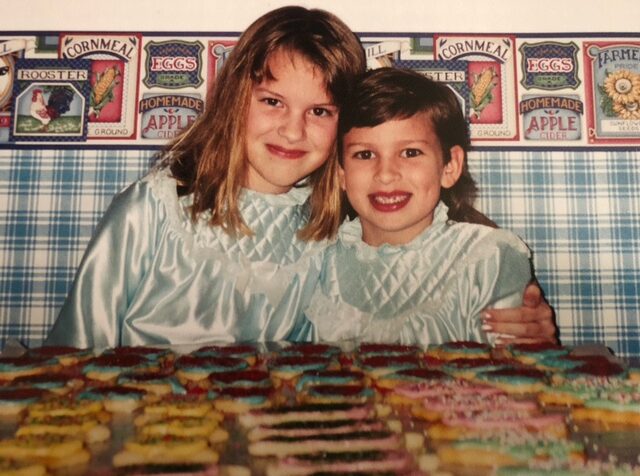 Kim Sutter's daughters, Amber and Heather, when they were young, with a fresh batch of Grandma Geisler's Christmas cookies. (Courtesy of Kim Sutter)