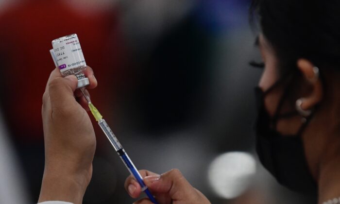A nurse prepares the Oxford-AstraZeneca COVID-19 vaccine in Mexico City on Dec. 7, 2021. (Pedro Pardo/AFP via Getty Images)