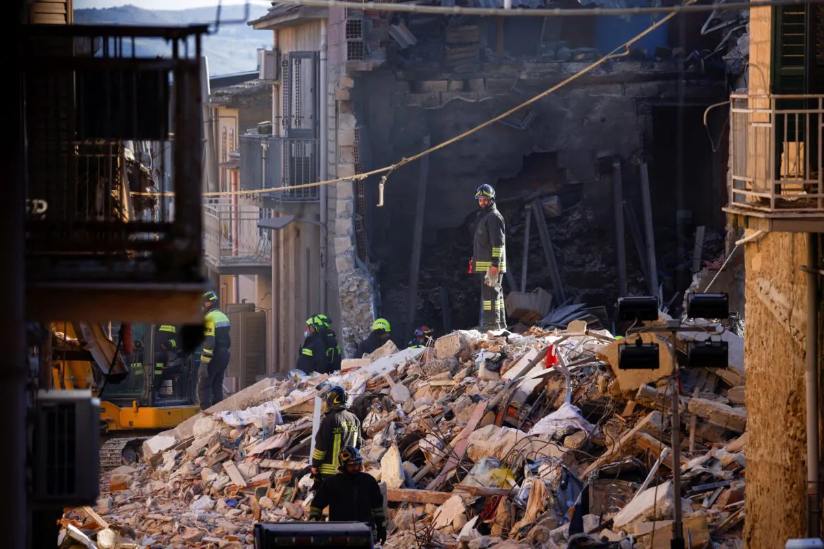 Rescuers work at the site of a gas explosion that caused several houses to collapse in Ravanusa, Italy, on Dec. 13, 2021. (Guglielmo Mangiapane/Reuters)