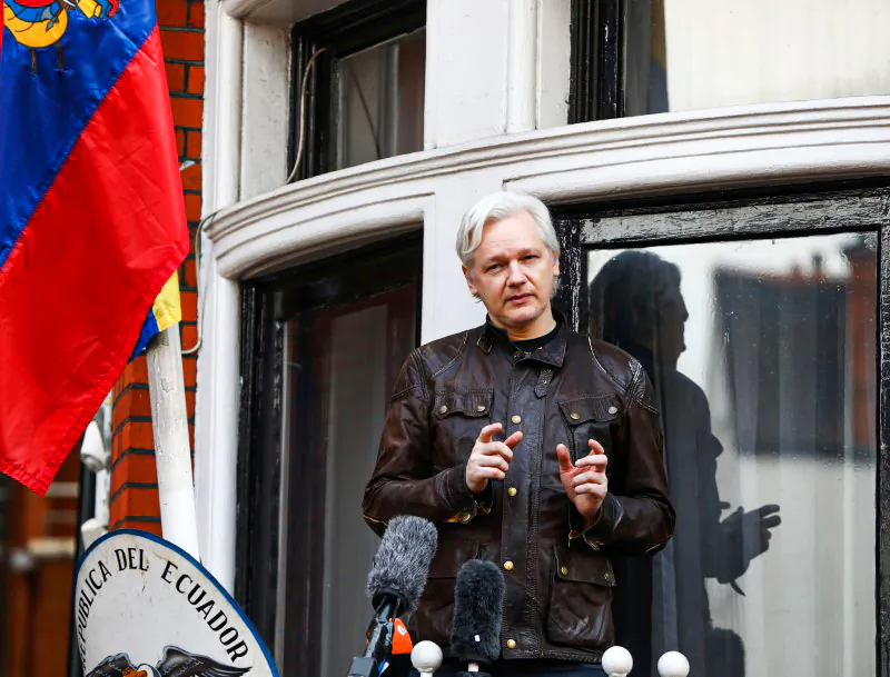 WikiLeaks founder Julian Assange speaks on the balcony of the Embassy of Ecuador in London, on May 19, 2017. (Neil Hall/Reuters)