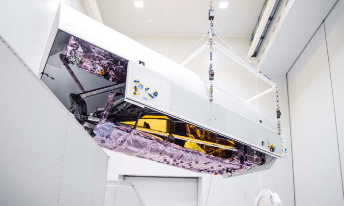 Engineers unpack, clean, and prepare the James Webb Space Telescope ahead of its scheduled launch into orbit, upon its arrival at the launch site in Kourou, French Guiana, as seen in this NASA image released on Nov. 2, 2021 and obtained by Reuters on Dec. 13, 2021. (NASA/Chris Gunn/Handout via Reuters)