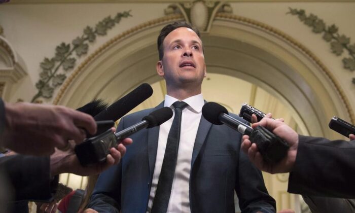 Parti Quebecois member of the National Assembly Alexandre Cloutier responds to reporters, June 6, 2017 at the legislature in Quebec City. (The Canadian Press/Jacques Boissinot) 