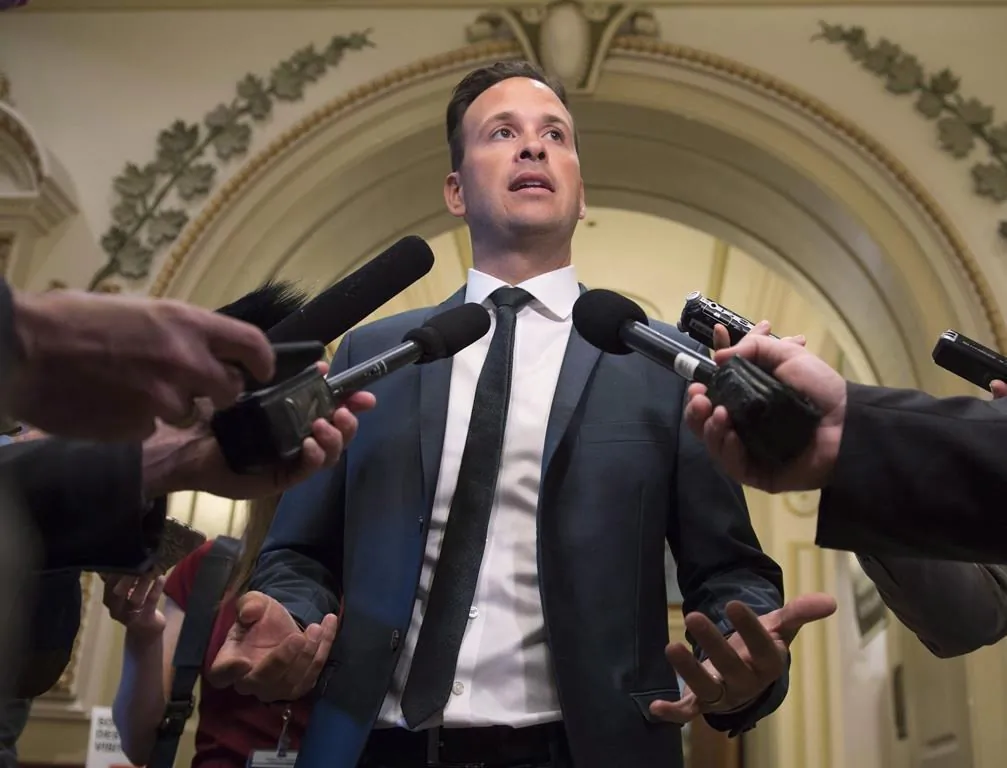 Parti Quebecois member of the National Assembly Alexandre Cloutier responds to reporters, June 6, 2017 at the legislature in Quebec City. (The Canadian Press/Jacques Boissinot)
