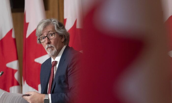 Privacy Commissioner of Canada Daniel Therrien listens to a question during a news conference, Dec. 9, 2021 in Ottawa. (The Canadian Press/Adrian Wyld)
