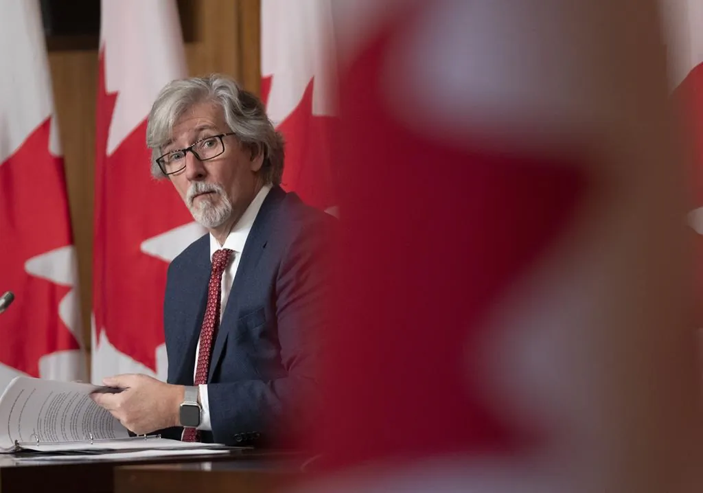 Privacy Commissioner of Canada Daniel Therrien listens to a question during a news conference, Dec. 9, 2021 in Ottawa. (The Canadian Press/Adrian Wyld)