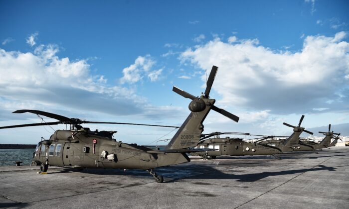 US Army helicopters are parked in the port of Alexandroupoli, Northern Greece, on December 3, 2021. (Photo by Sakis MITROLIDIS / AFP) 