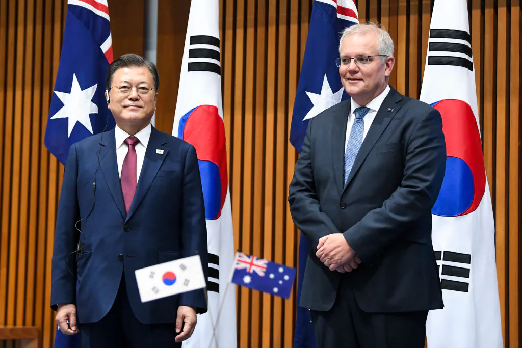 South Korean President Moon Jae-in and Australian Prime Minister Scott Morrison witness a signing ceremony at Parliament House in Canberra, Australia on Dec. 13, 2021. (Lukas Coch - Pool/Getty Images)