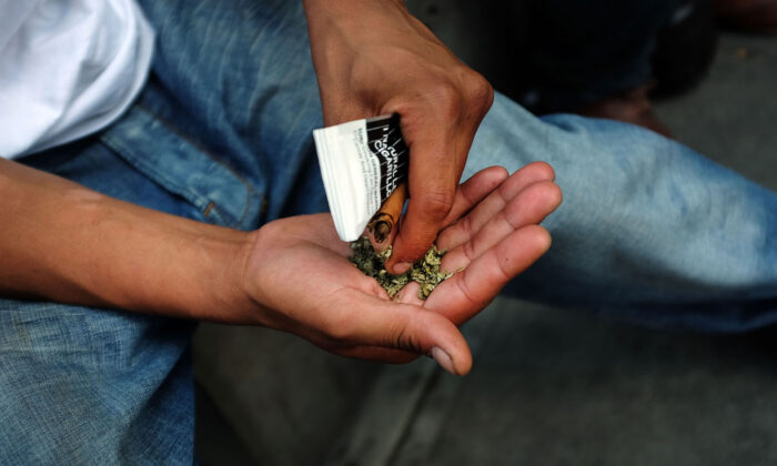 A man prepares to smoke "Spice", a synthetic marijuana drug, in New York City on Aug. 5, 2015. (Spencer Platt/Getty Images)
