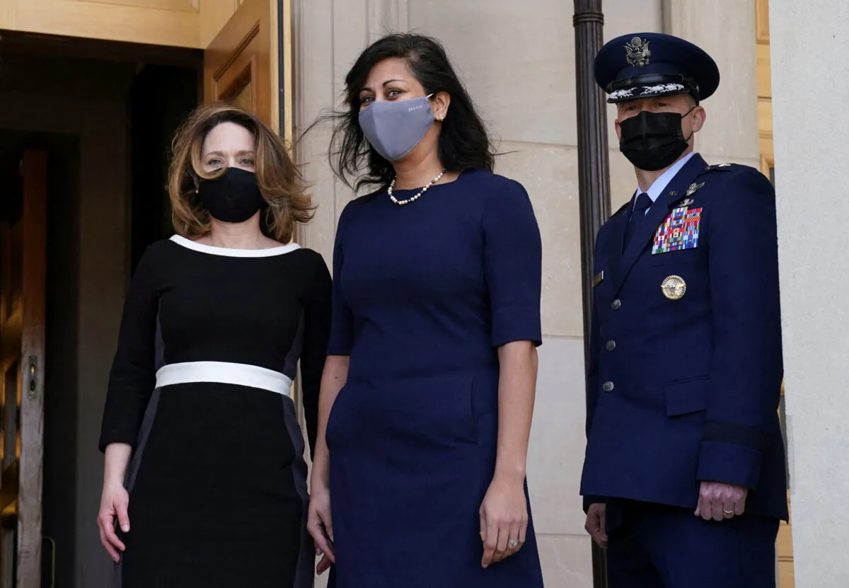 Kathleen Hicks (L), the first female U.S. deputy defence secretary, arrives for the first day in her new role at the Pentagon in Arlington, Va., on Feb. 9 2021. (Kevin Lamarque/Reuters)