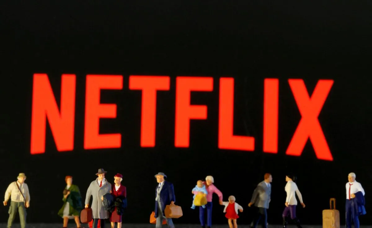 Small toy figures are seen in front of displayed Netflix logo in this
illustration taken on March 19, 2020. (Dado Ruvic/Reuters)