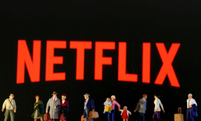 Small toy figures are seen in front of displayed Netflix logo in this 
illustration taken on March 19, 2020. (Dado Ruvic/Reuters)