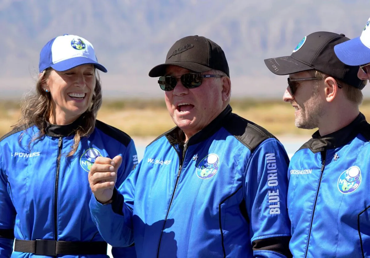 William Shatner (C) speaks as Audrey Powers (L) and Chris Boshuizen appear during a press availability at the Blue Origin spaceport near Van Horn, Texas, on Oct. 13, 2021. (LM Otero/AP Photo)