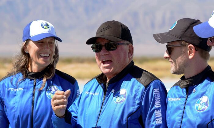 William Shatner (C) speaks as Audrey Powers (L) and Chris Boshuizen appear during a press availability at the Blue Origin spaceport near Van Horn, Texas, on Oct. 13, 2021. (LM Otero/AP Photo)