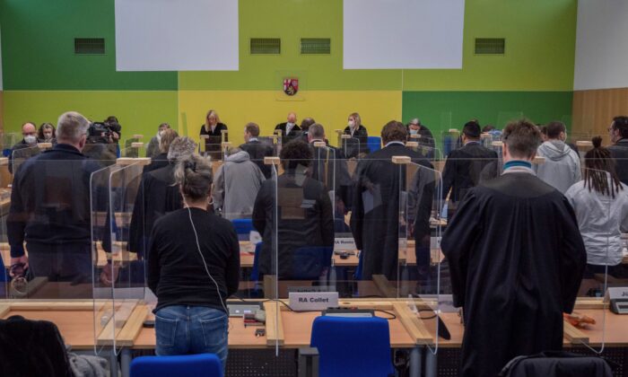 Presiding judge G'nther Koehler announces the verdicts in the so-called Cyberbunker trial at the regional court in Trier, Germany, on Dec. 13, 2021. (Harald Tittel/dpa via AP)