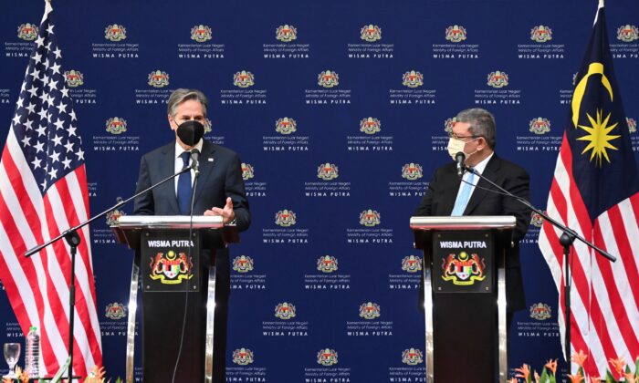 U.S. Secretary of State Antony Blinken, left, speaks next to Malaysian Foreign Minister Saifuddin Abdullah during a press conference at foreign ministry in Putrajaya, Malaysia, on Dec. 15, 2021. (Jai Huzaini/Ministry of Foreign Affair via AP)
