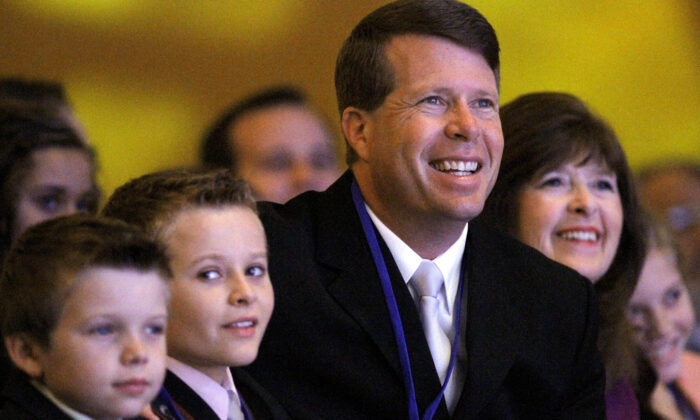 Jim Bob Duggar and his family listen as former Arkansas Gov. Mike Huckabee speaks to the Values Voter Summit, held by the Family Research Council Action, in Wash., on Sept. 17, 2010. (Jacquelyn Martin/AP Photo)                