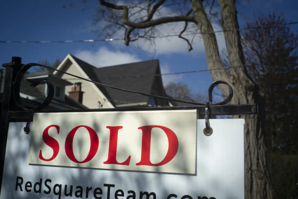 A real estate sold sign is shown in a Toronto west end neighbourhood on May 16, 2020. (The Canadian Press/Graeme Roy)