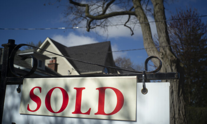 A real estate sold sign is shown in a Toronto west end neighbourhood on May 16, 2020. (The Canadian Press/Graeme Roy)