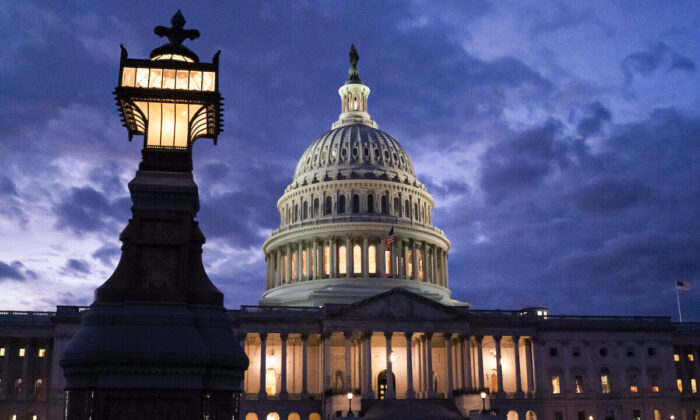 Night falls at the the Capitol in Washington on Dec. 2, 2021. (AP Photo/J. Scott Applewhite)