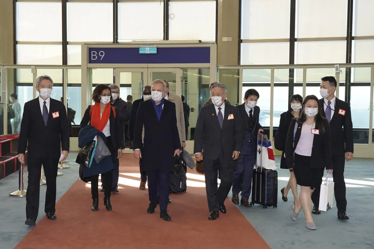 A group of French lawmakers arriving at the airport in Taoyuan, northern Taiwan, on Dec. 15, 2021. (Taiwan Ministry of Foreign Affairs via AP)