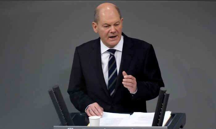 German Chancellor Olaf Scholz delivers a speech during a meeting of the German federal parliament, Bundestag, at the Reichstag building in Berlin, on Dec. 15, 2021. (Michael Sohn/AP Photo)