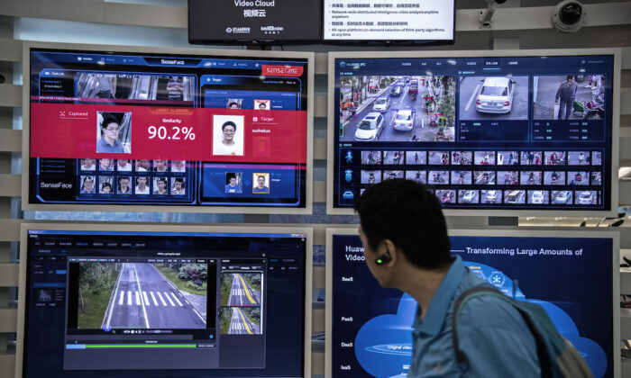 A display for facial recognition and artificial intelligence is seen on monitors at Huawei's Bantian campus on April 26, 2019, in Shenzhen, China. (Kevin Frayer/Getty Images)