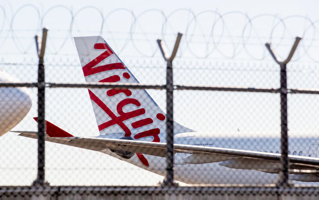 Grounded Virgin planes are seen parked on a tarmac at Brisbane Airport in Brisbane, Australia, on April 21, 2020. (Jono Searle/Getty Images)