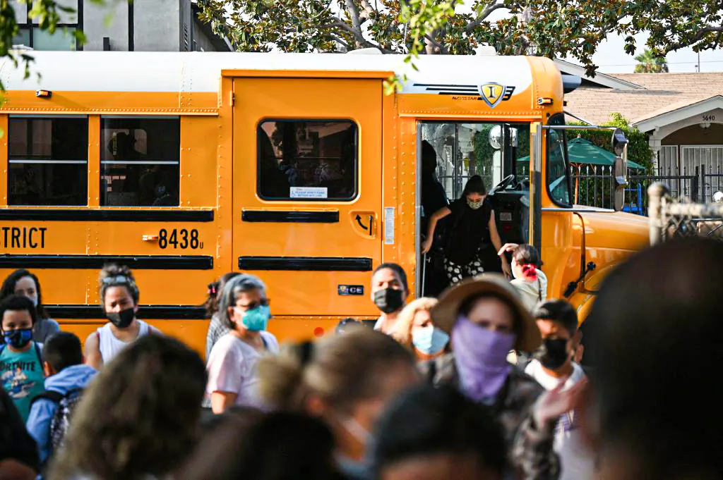Students and parents arrive masked for the first day of the school year at Grant Elementary School in Los Angeles, Calif., on Aug. 16, 2021. (Robyn Beck/AFP via Getty Images)