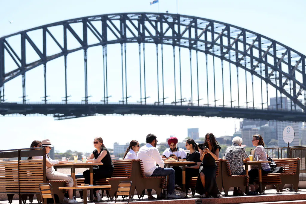 People dine outdoors at Opera House Bar in Sydney, Australia, on Oct. 18, 2021. (Brendon Thorne/Getty Images)