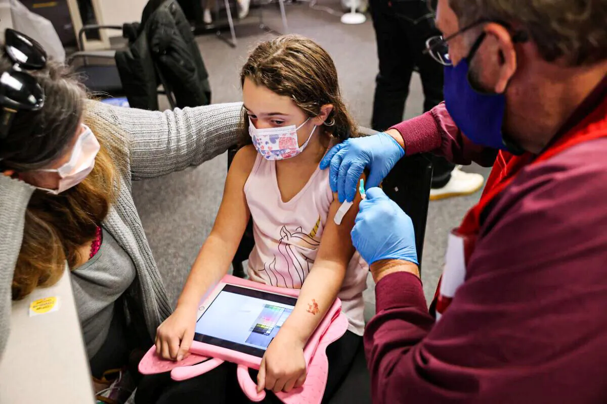 A child receives a COVID-19 vaccine in a file photo. (Chip Somodevilla/Getty Images)
